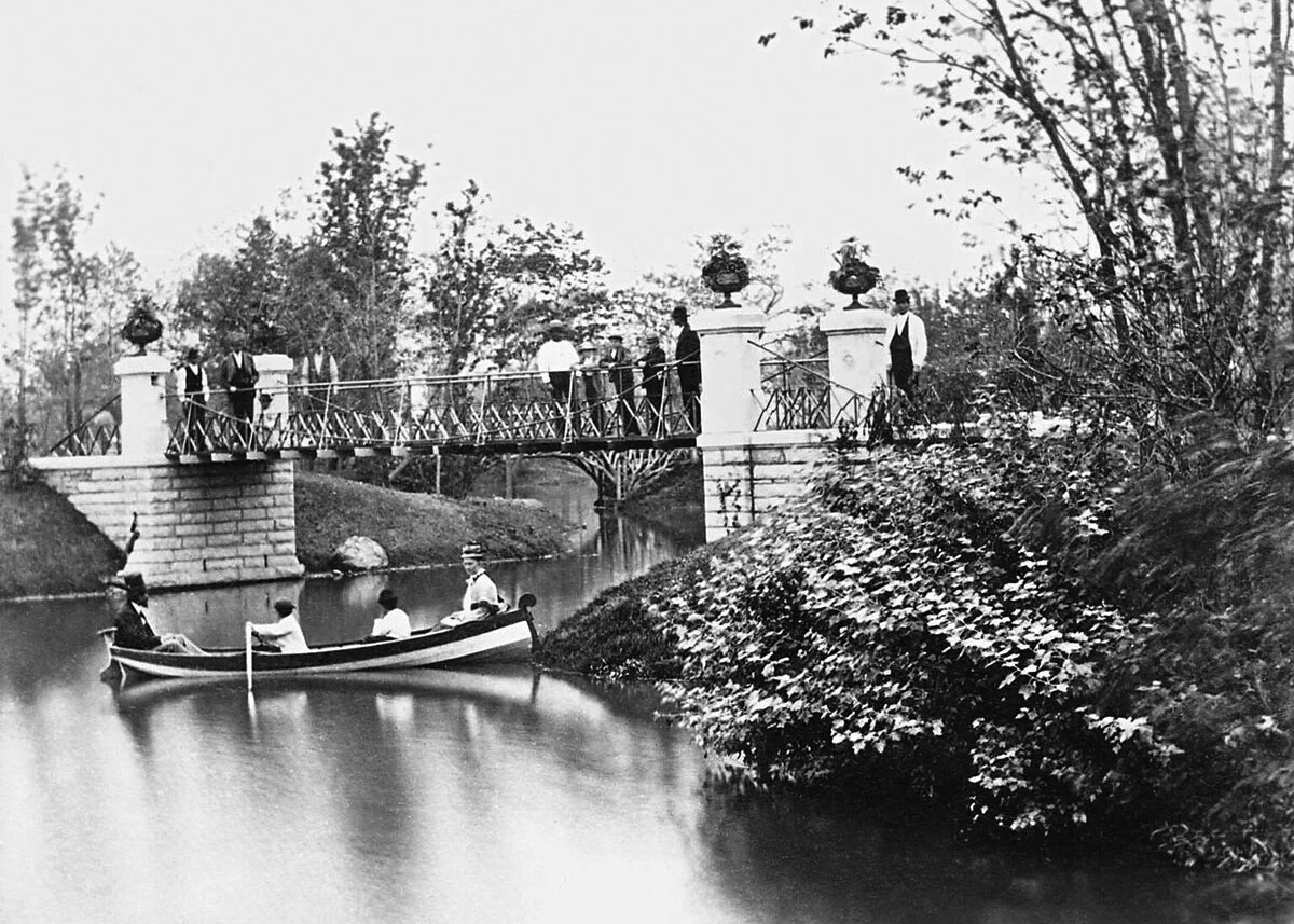 Boaters near suspension bridge in Central (Garfield) Park, 1875. From Sixth Annual Report of West Chicago Park Commissioners .