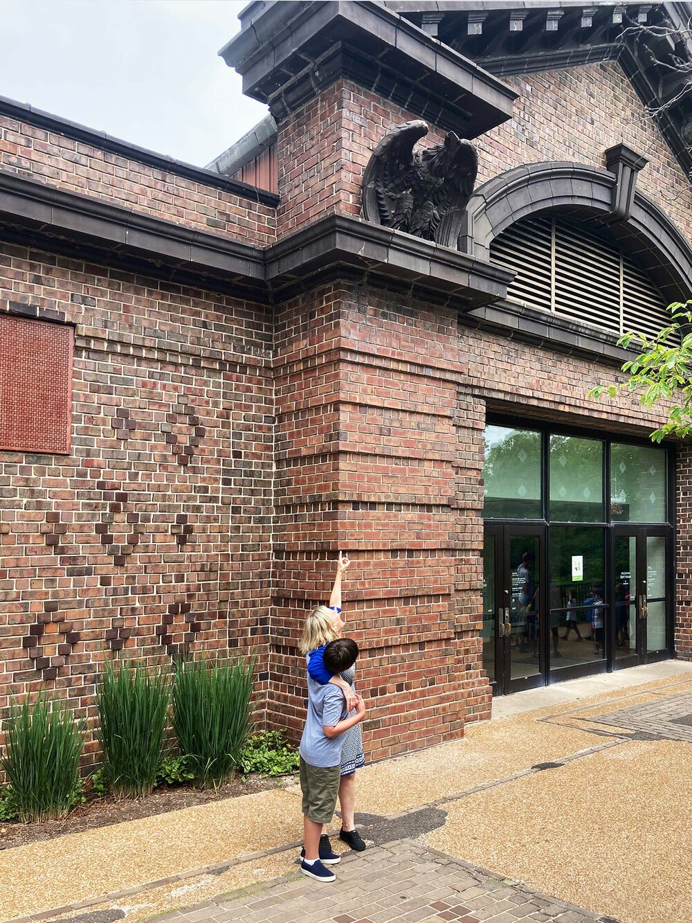 I pointed out the ornamental bird perched on the cornice above the Bird House entrance to Cooper. Photo by Wendy Littlefield.