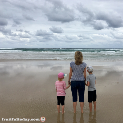 Caption: A rare treat: taking a walk along the beach as a family (my husband is behind the camera).
