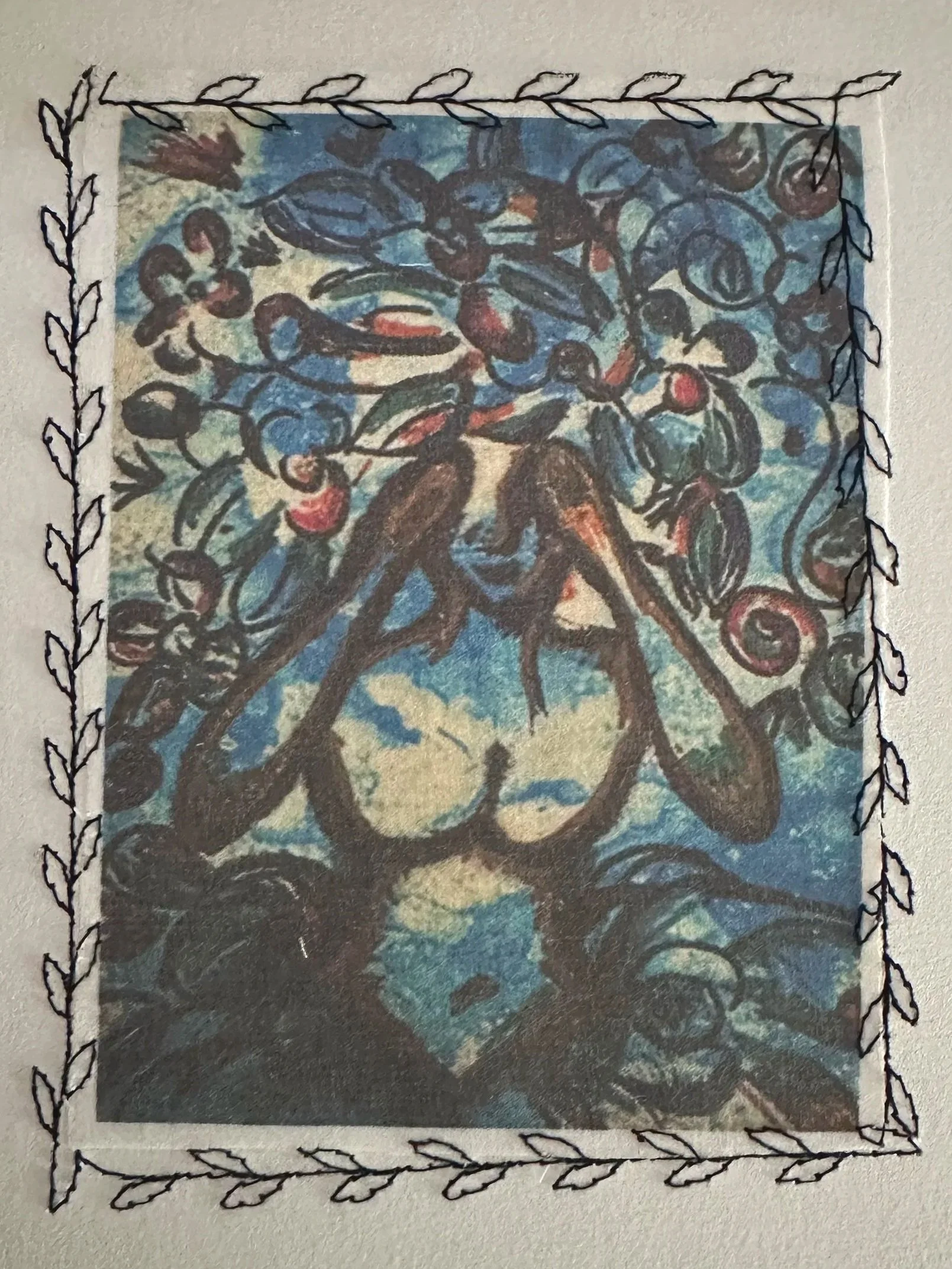 Marker illustration of a woman with her hands cradling her face, eyes unseen, her hair flowing upward into vines, leaves, and blooms against a blue background. Stitched fabric art print by Aldrena Hicks.