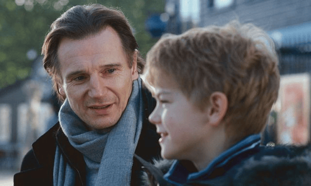 Liam Neeson and Thomas Sanger in "Love, Actually"