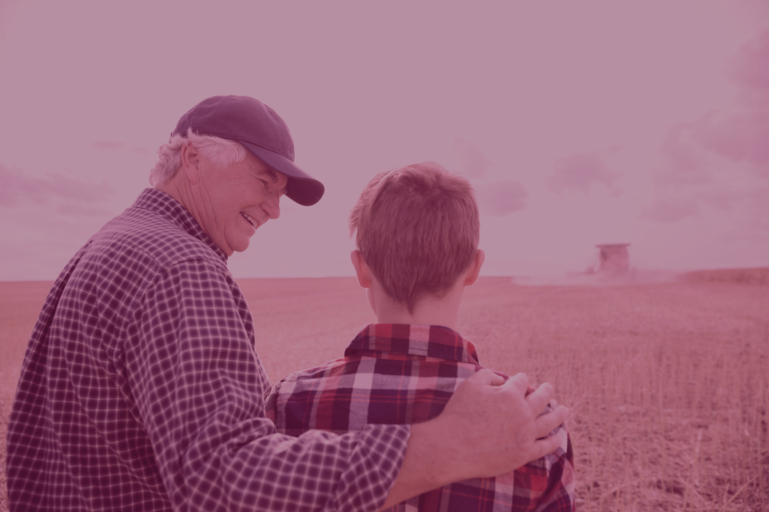 grandfather-and-grandson-watching-combine-harvester-in-field-518338085-57a620e43df78cf45902f7fd.jpg