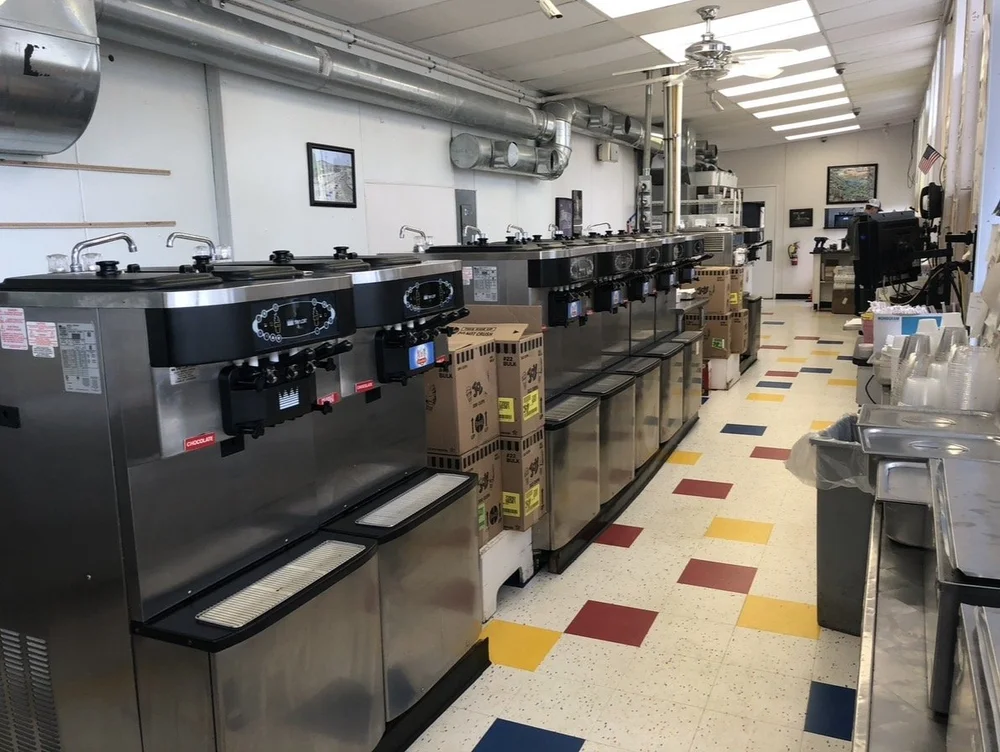 Ice cream shop with 11 Taylor soft serve machines in a line