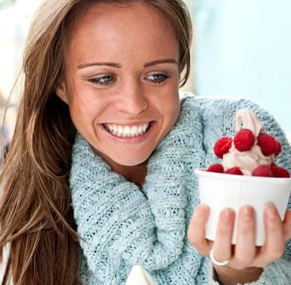 Woman enjoying frozen yogurt soft serve