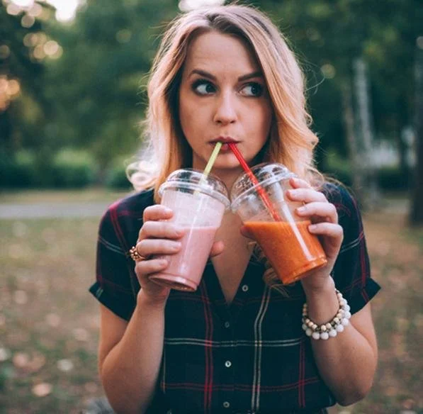 Two people enjoying frozen smoothies together