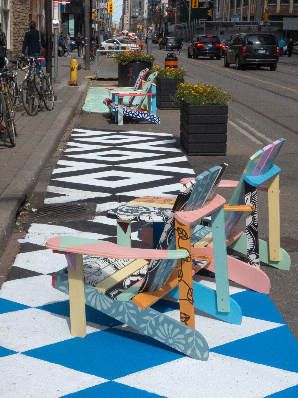 It paired eight hand-painted Adirondack chairs with an 80-foot-long road mural, instantly becoming a popular and coveted spot to take a break.
