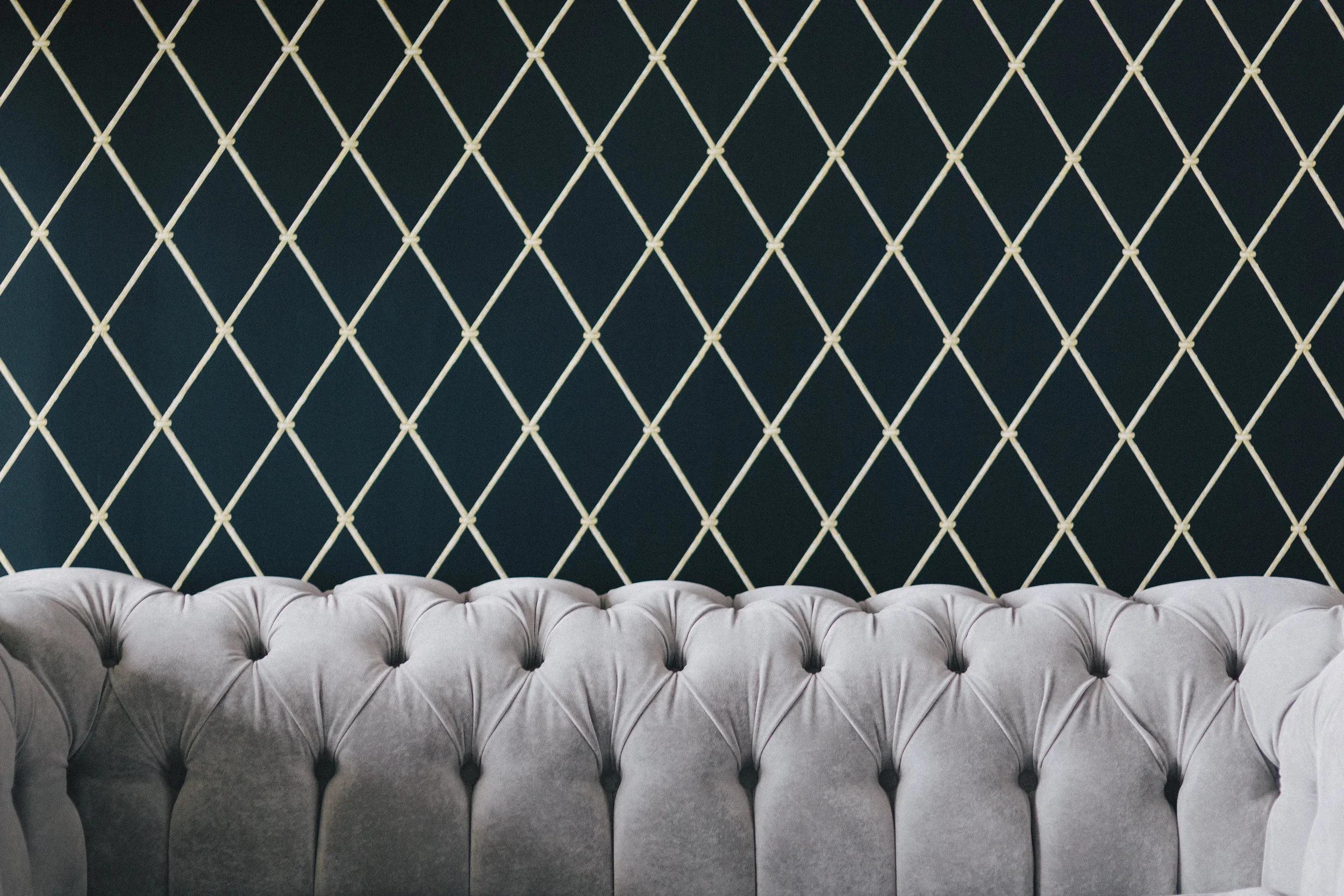 kaboompics.com_Back of luxury sofa against patterned wallpaper.jpg