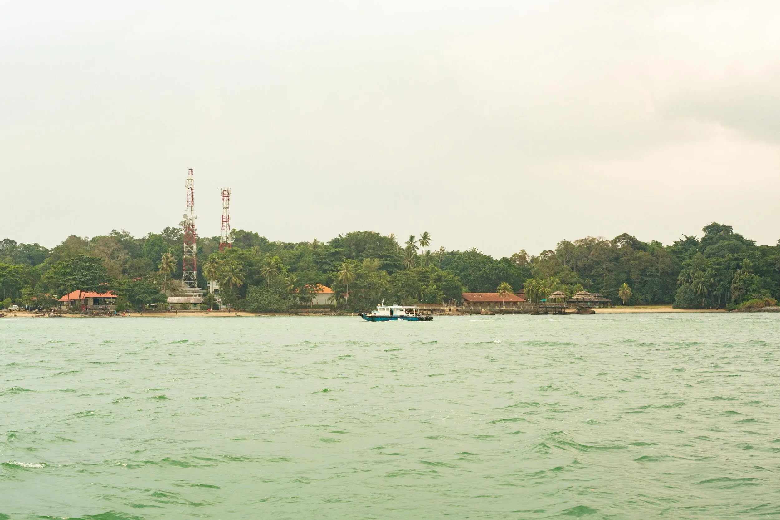 A Bumboat, with Pulau Ubin in the background