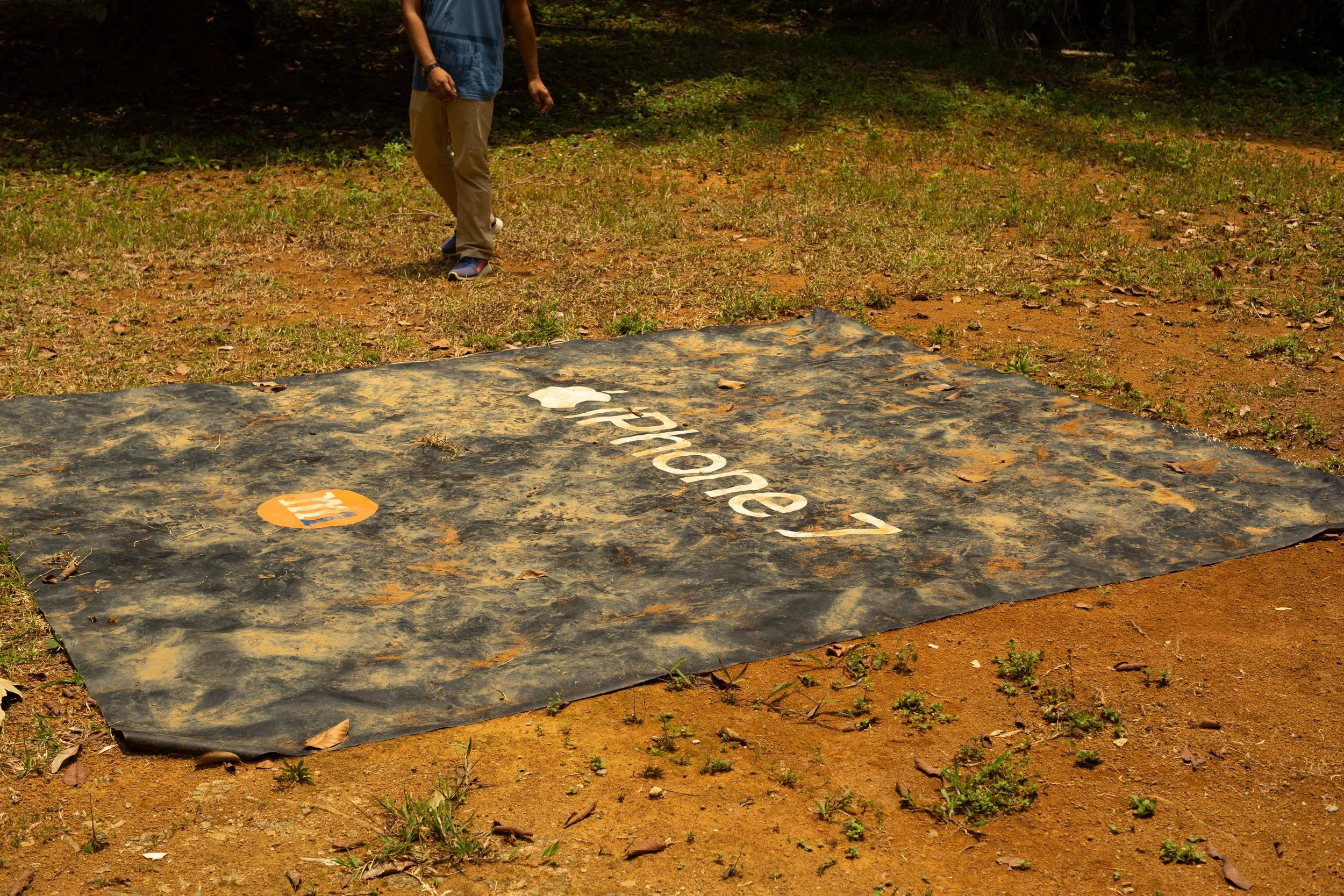 A promotional iPhone 7 poster gets a new life as a mat outside a Kampong Sungei Durian home