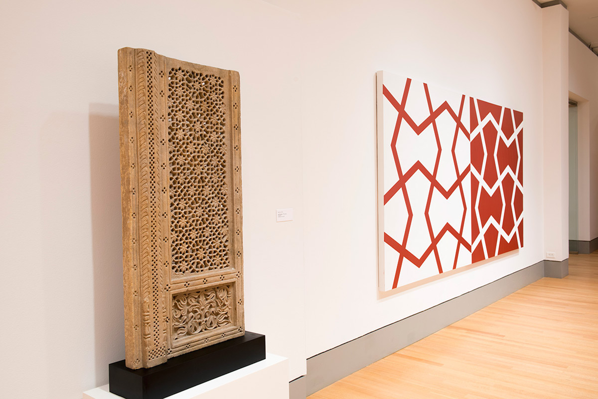  Left: Mughal Jali Screen. 18th century. Sandstone.  Right: Jali XXVI: Sashay Red and White. 2011. Acrylic on two canvases. 72 x 144 in., 182.9 x 365.8 cm. 