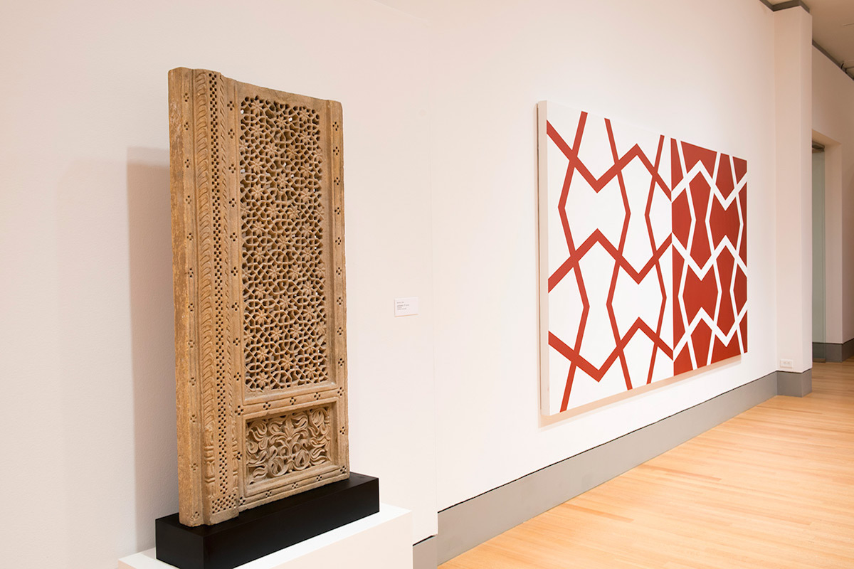 Left: Mughal Jali Screen. 18th century. Sandstone. Right: Jali XXVI: Sashay Red and White. 2011. Acrylic on two canvases. 72 x 144 in., 182.9 x 365.8 cm.
