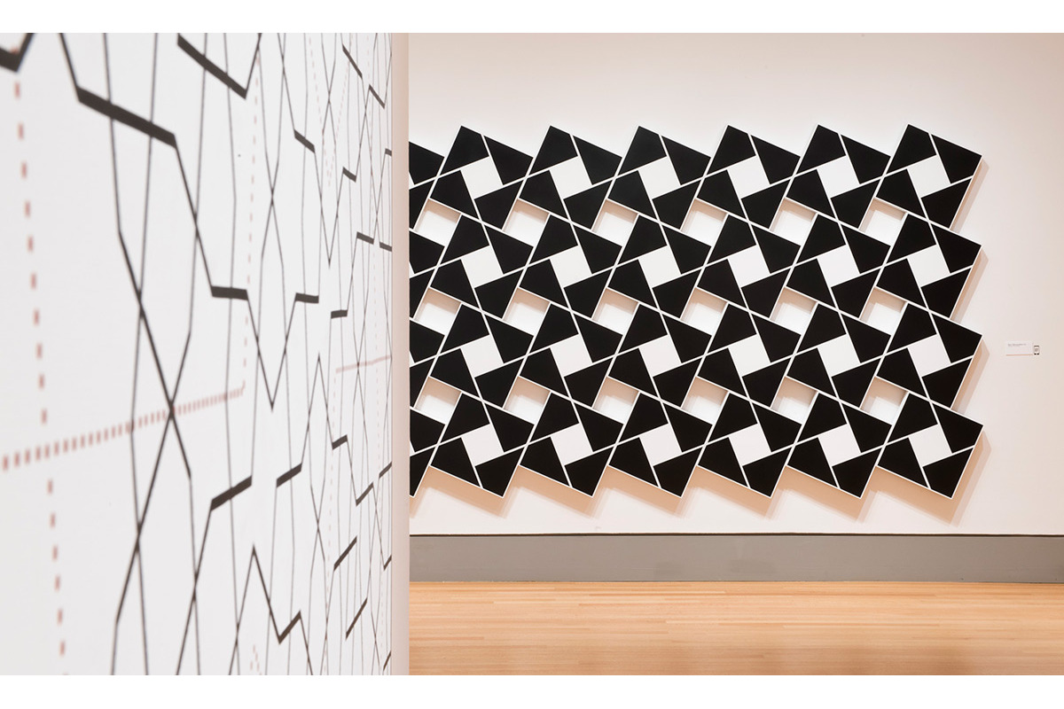  Foreground: Topkapi XXI. 2012. Acrylic on canvas. 72 x 72 in., 182.9 x 182.9 cm.  Background: Ajlun I: Black Pearl and White.&nbsp;2002. Acrylic on 32 canvases. 80 x 168 in., 203.2 x 426.7 cm. 