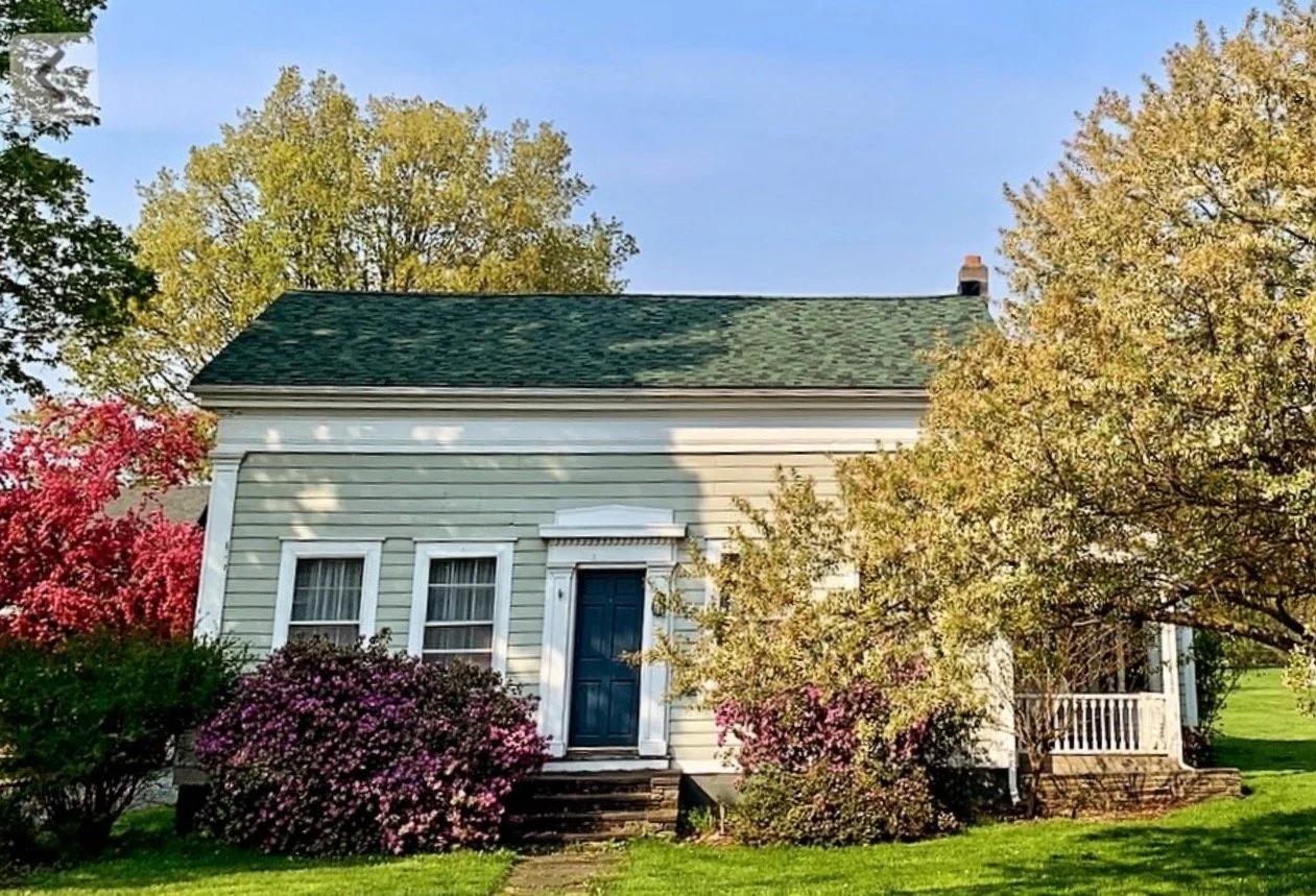 Front view of pet boarding home in Catskills farmhouse in spring