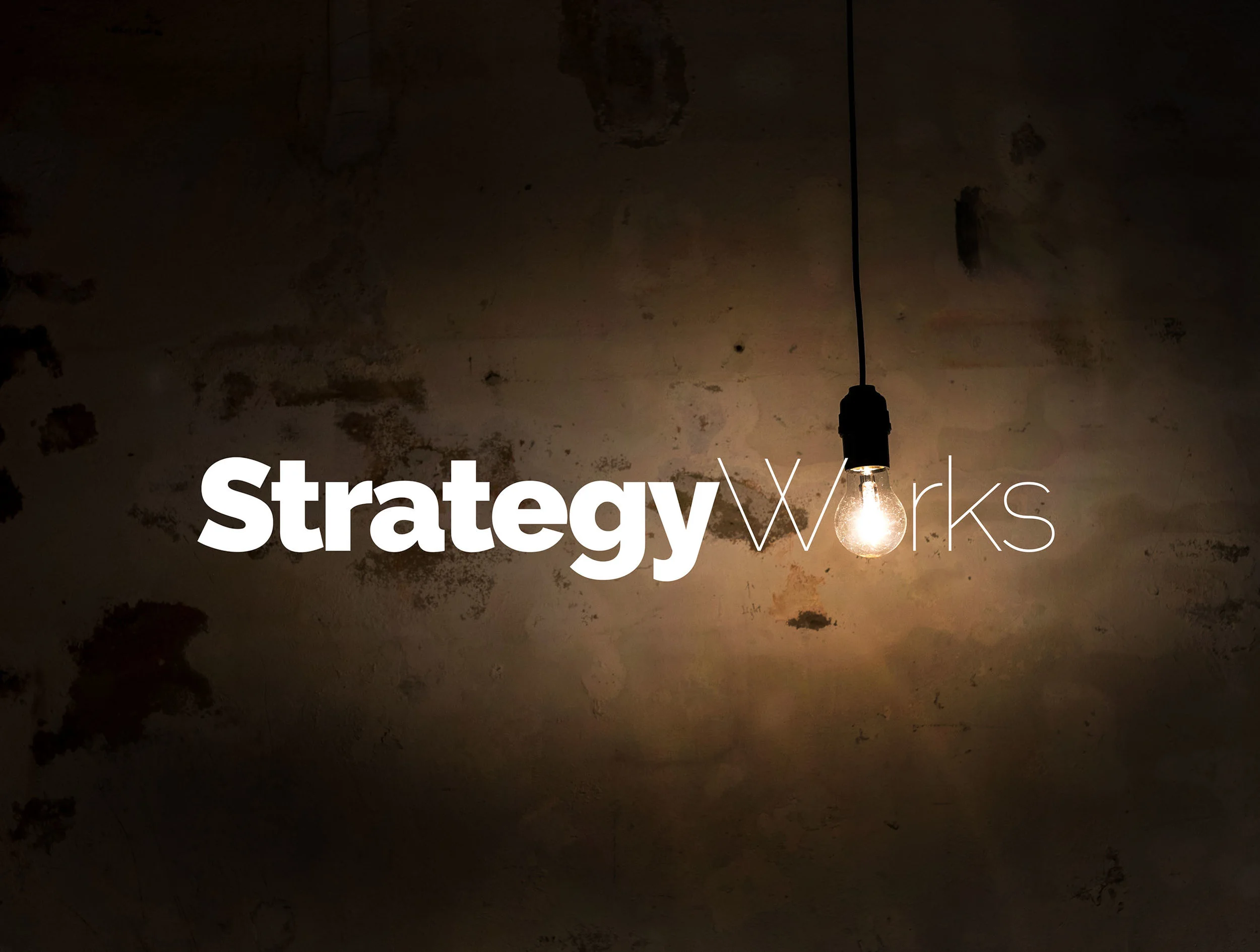 Strategy Works real light bulb and wall.jpg