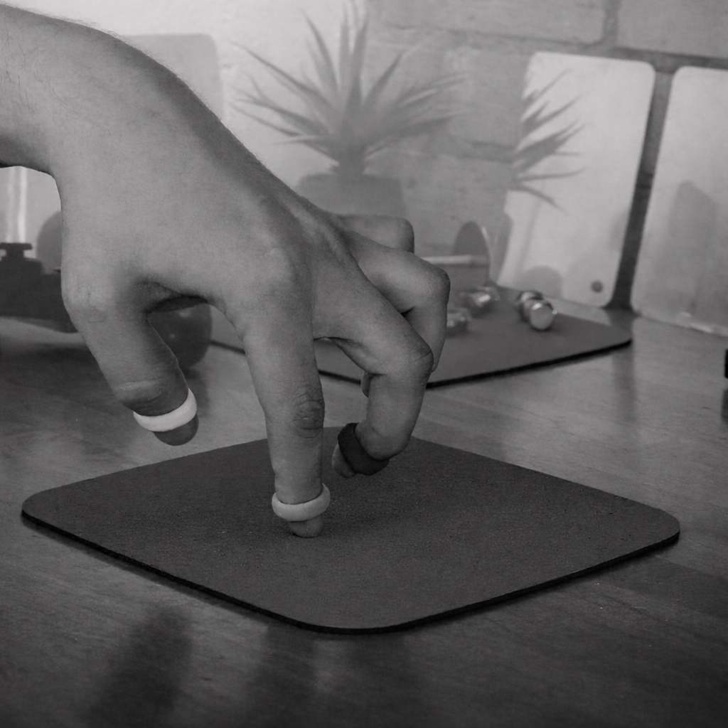 Focused grip on finger weights.png