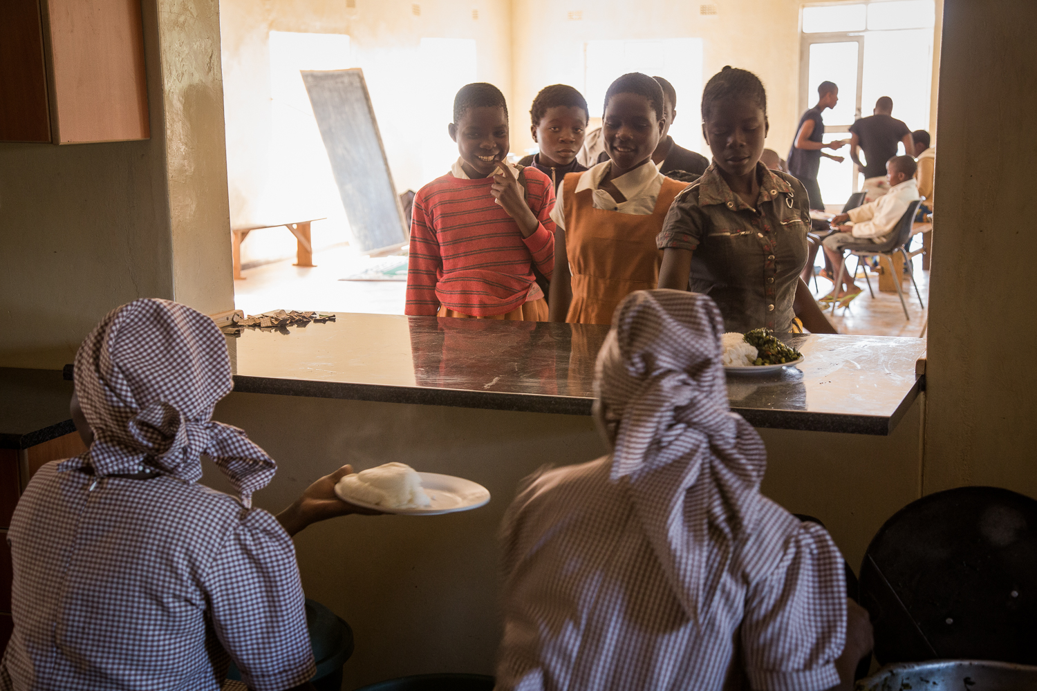  Kwithu feeds the neighborhood children a balanced, nutritious meal (with protein) a few times per week. Many of these children are single or double orphans (lost one or both parents). 