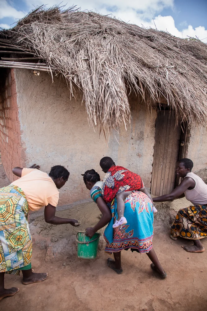 Mud is smeared on the front step of the homes weekly to fill the cracks. Have children? They women work with the children in-tow.