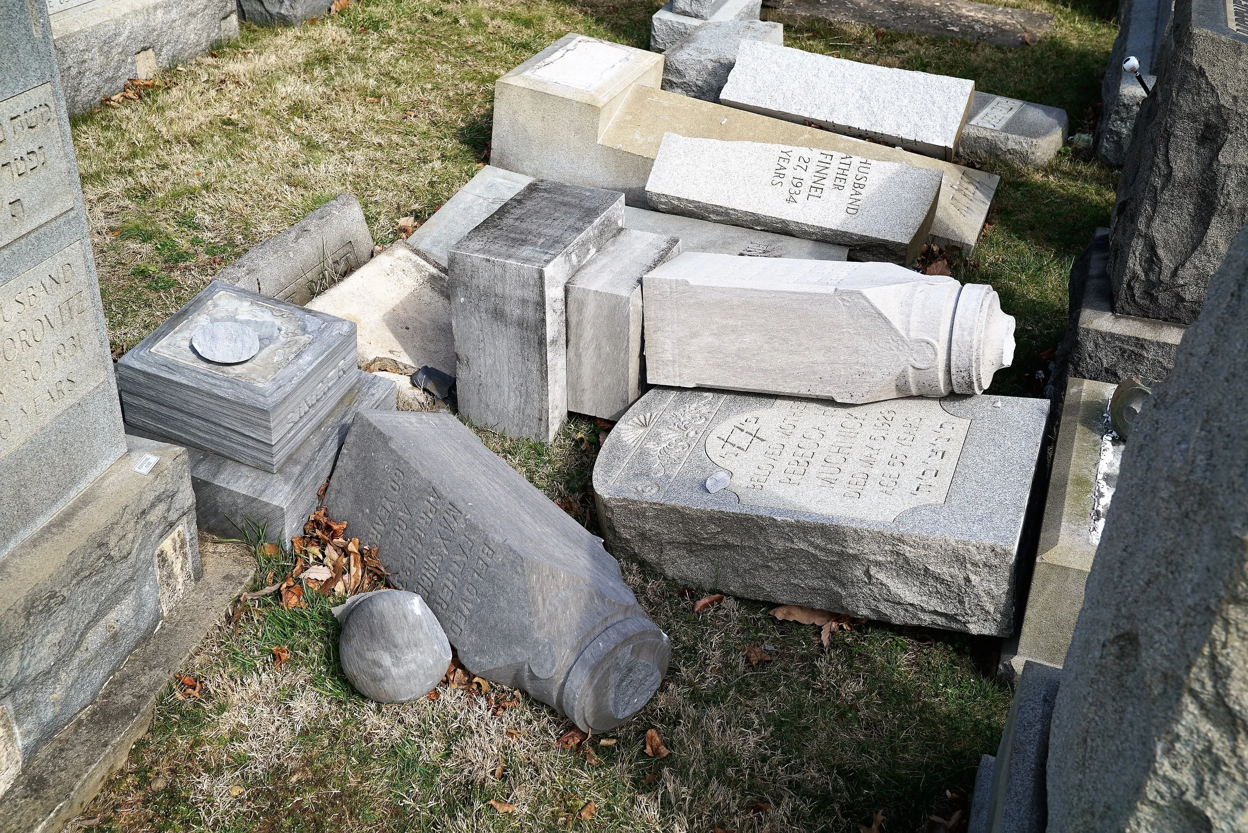 The scene at Mount Carmel Cemetery in Philadelphia, PA after vandals caused extensive damage to the cemetery.