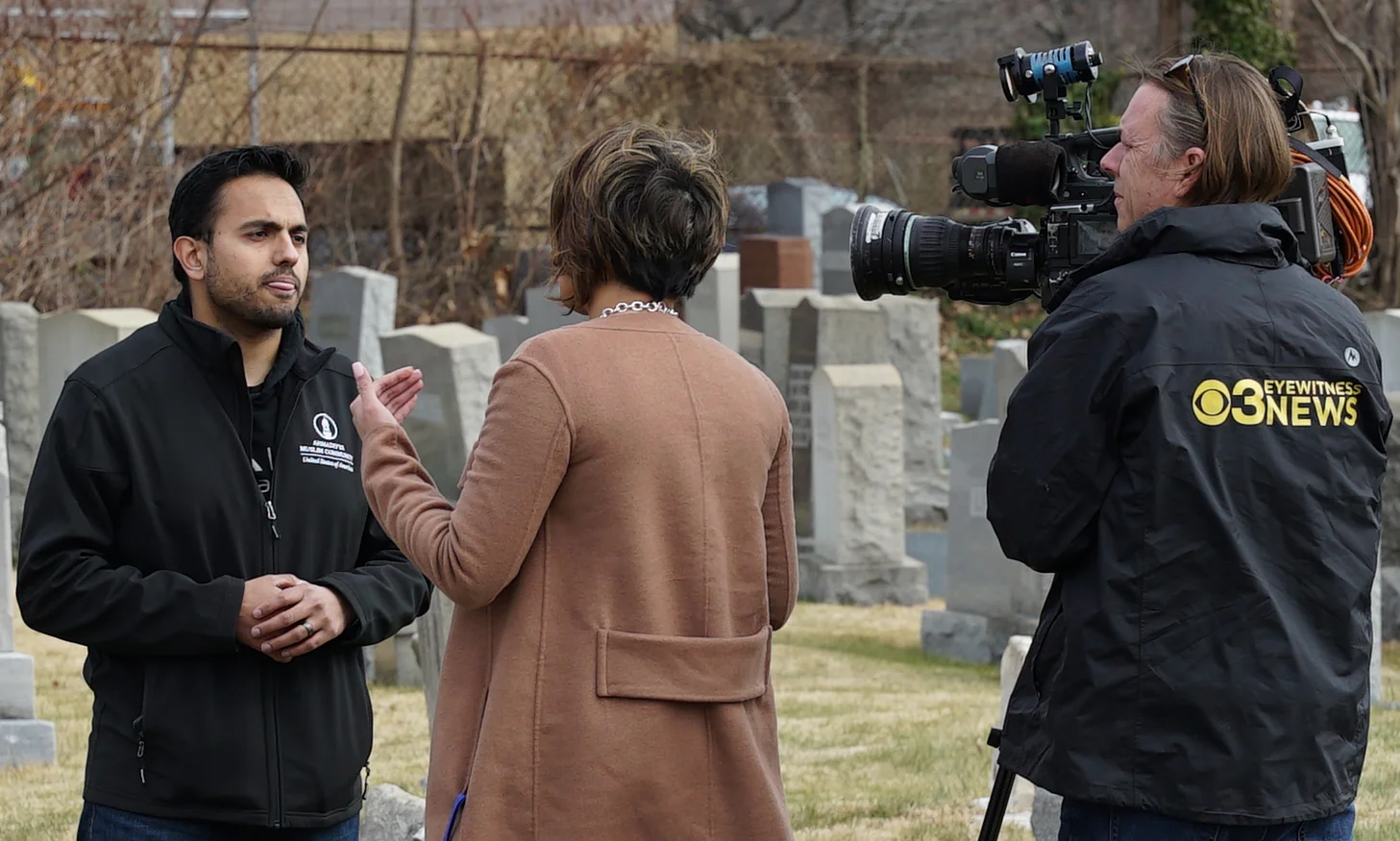 A man representing a Muslim cemetery being interviewed at Mount Carmel Jewish Cemetery in Philadelphia, Pennsylvania.