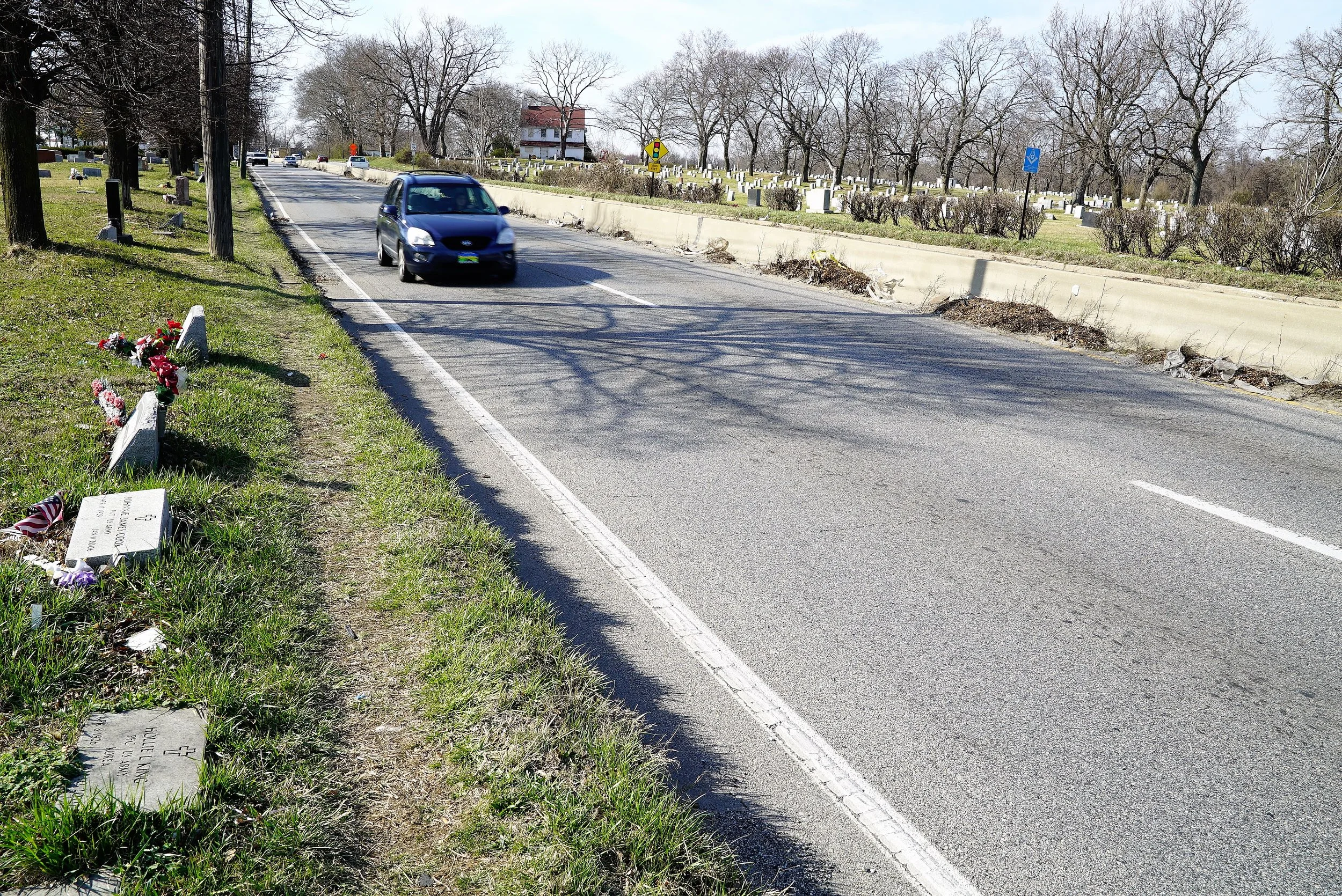 Mount Lawn Cemetery, Sharon Hill, PA: A busy four lane highway cuts through the cemetery. Headstones are just 3 or 4 feet from the highway in some areas. These headstones could easily get damaged if a vehicle veers off the road.