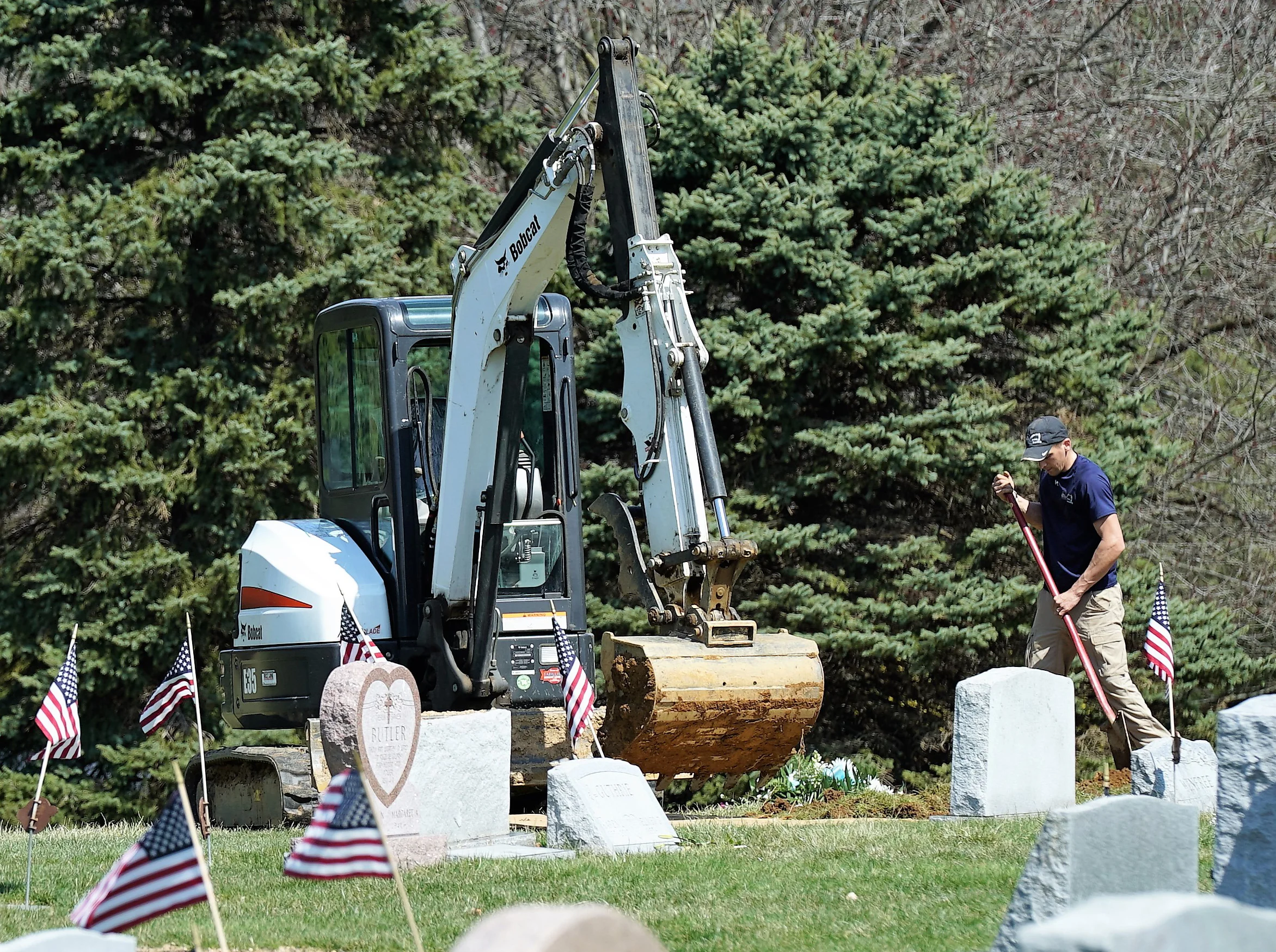 The grave digger at work. Elam United Methodist Church Cemetery. Glen Mills, Pennsylvania.
