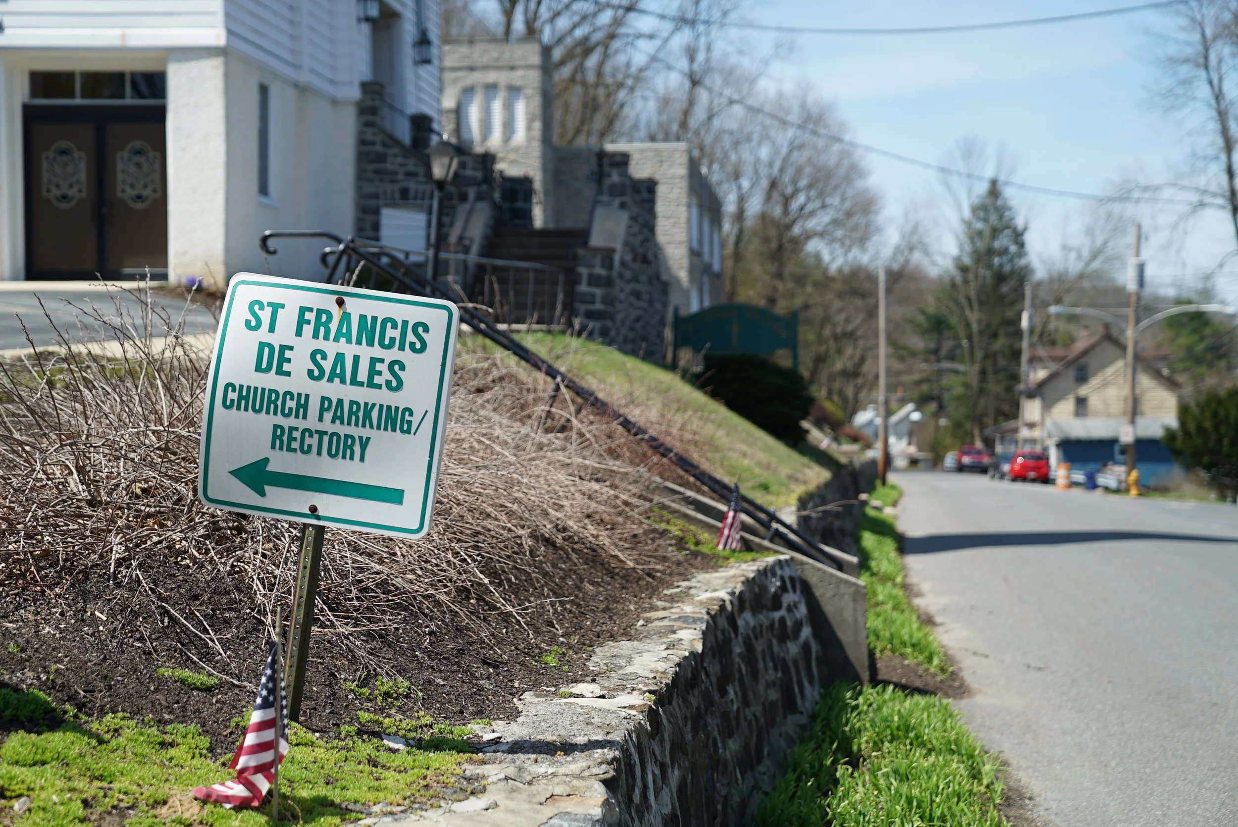 Sign pointing the way to Saint Francis De Sales Church Cemetery. Lenni, Pennsylvania.