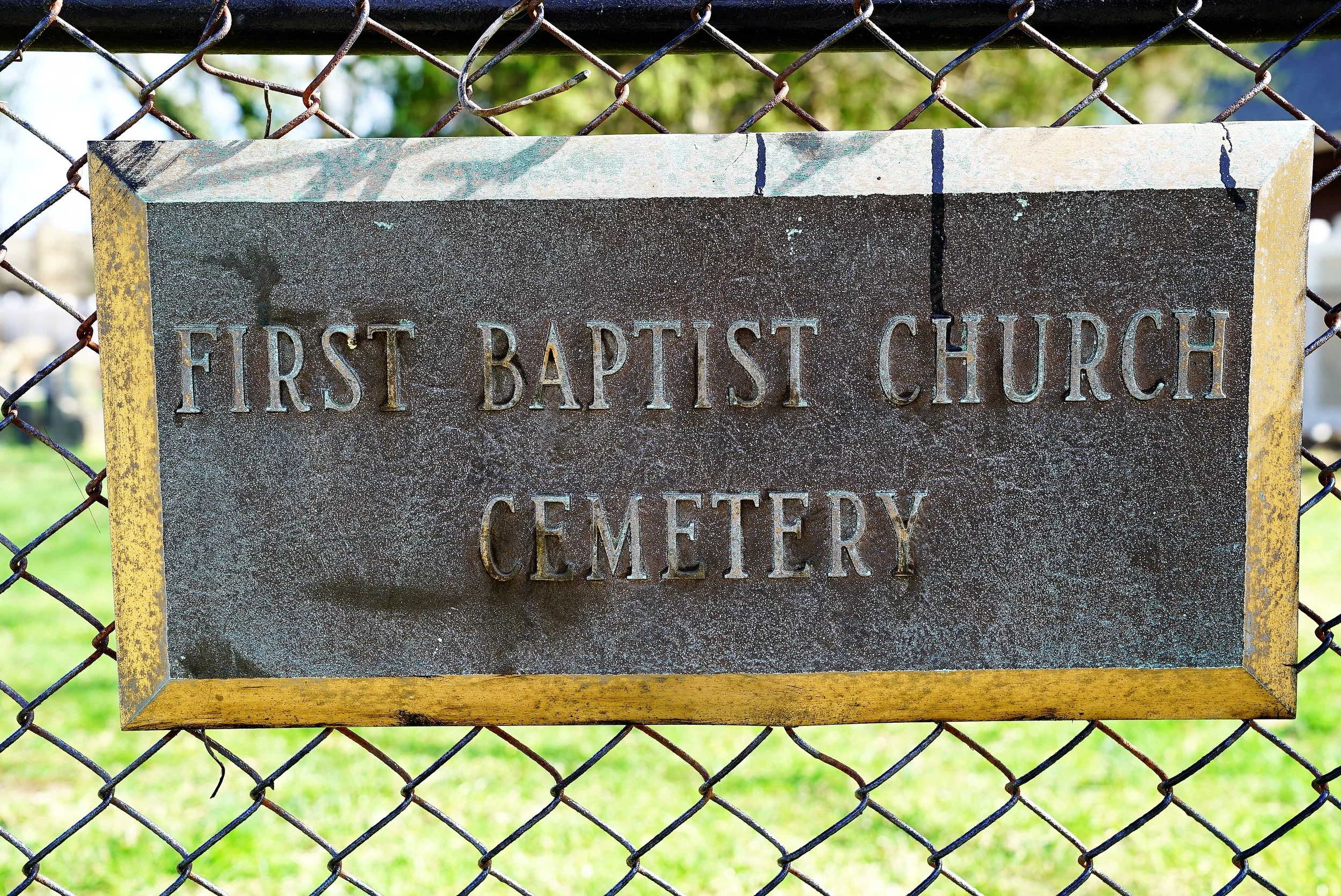 A sign at the sidewalk entrance to First Baptist Church Cemetery. Radnor, Pennsylvania.