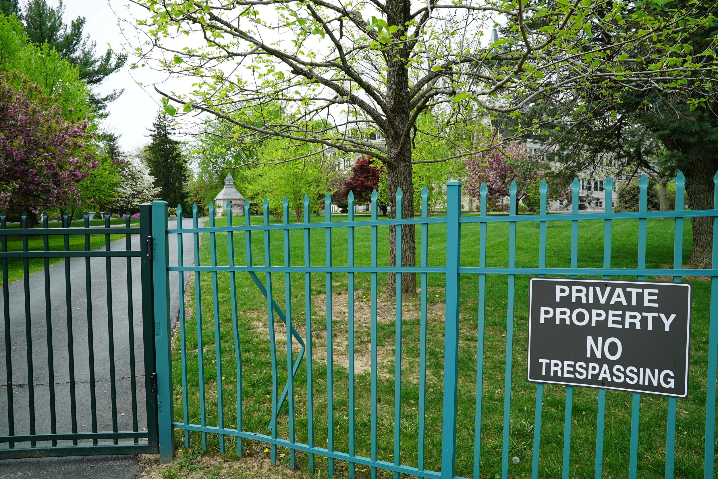 "No Trespassing" signs are prominently displayed at all entrances to the cemetery. Our Lady of Angels Cemetery. Aston, Pennsylvania.