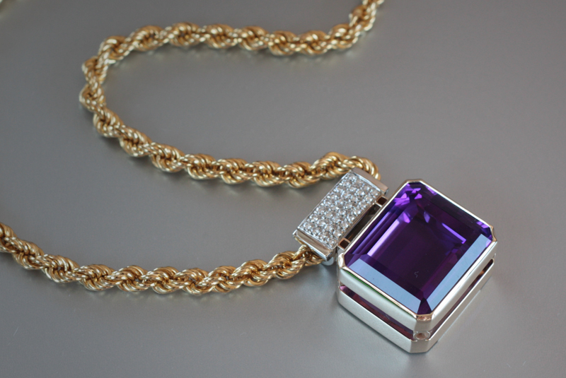   22x18 mm emerald cut amethyst pendant&nbsp;with .5 ct. t.w. of diamonds on an 18k yellow gold chain  