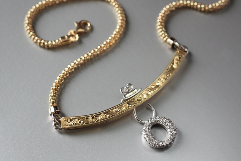   18k handmade, hand-engraved neckpiece with a&nbsp;round pave diamond dangling charm  