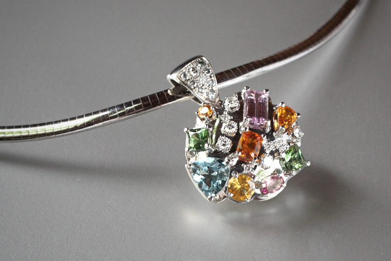    Fiesta-  18k white gold pendant with numerous gemstones and&nbsp;diamonds&nbsp;in varying shapes and sizes  