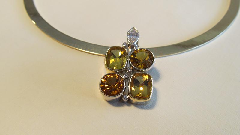   Combination white and yellow gold pendant bezel set with diamonds, topaz and citrine  