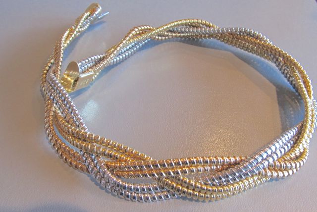   18k tri-gold (rose, white and yellow) interwoven snake necklace  