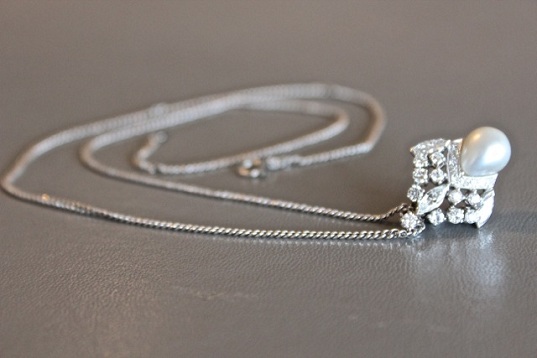   Platinum and diamond pendant that can also be worn as a ring  