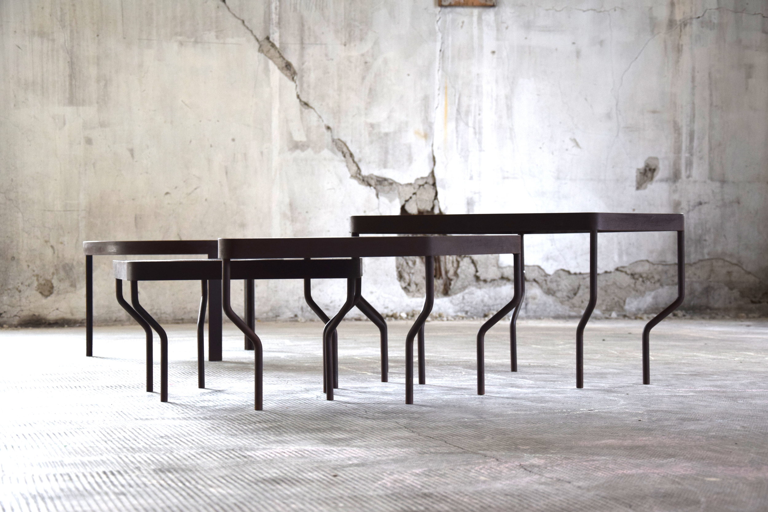 These tables imagine the unknown using a very special technique . Whimsical planets are realized in mosaic made of glass , and are embedded in a universe made of black marble terrazzo, that seems to glitter with stardust.