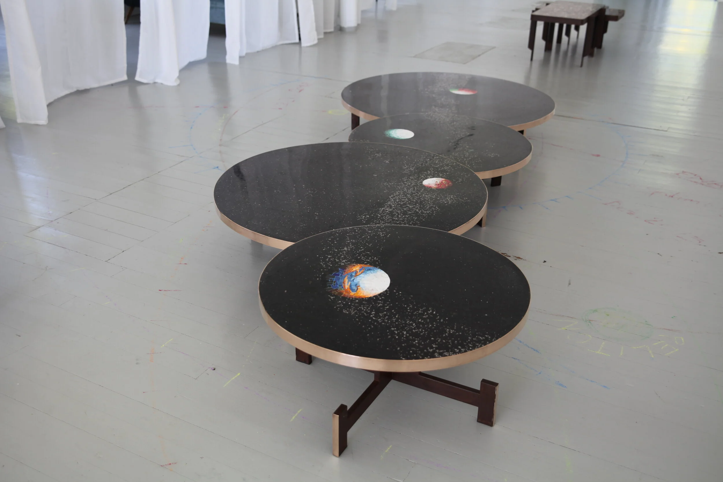  The main focus lies on the I Pianeti Sconosciuti – The Unknown Planets – a unique combination of Mosaic and Terrazzo as well as on the Lovelytables a series of small tables which combines the two contrasting groups of materials of Terrazzo and Oxidi