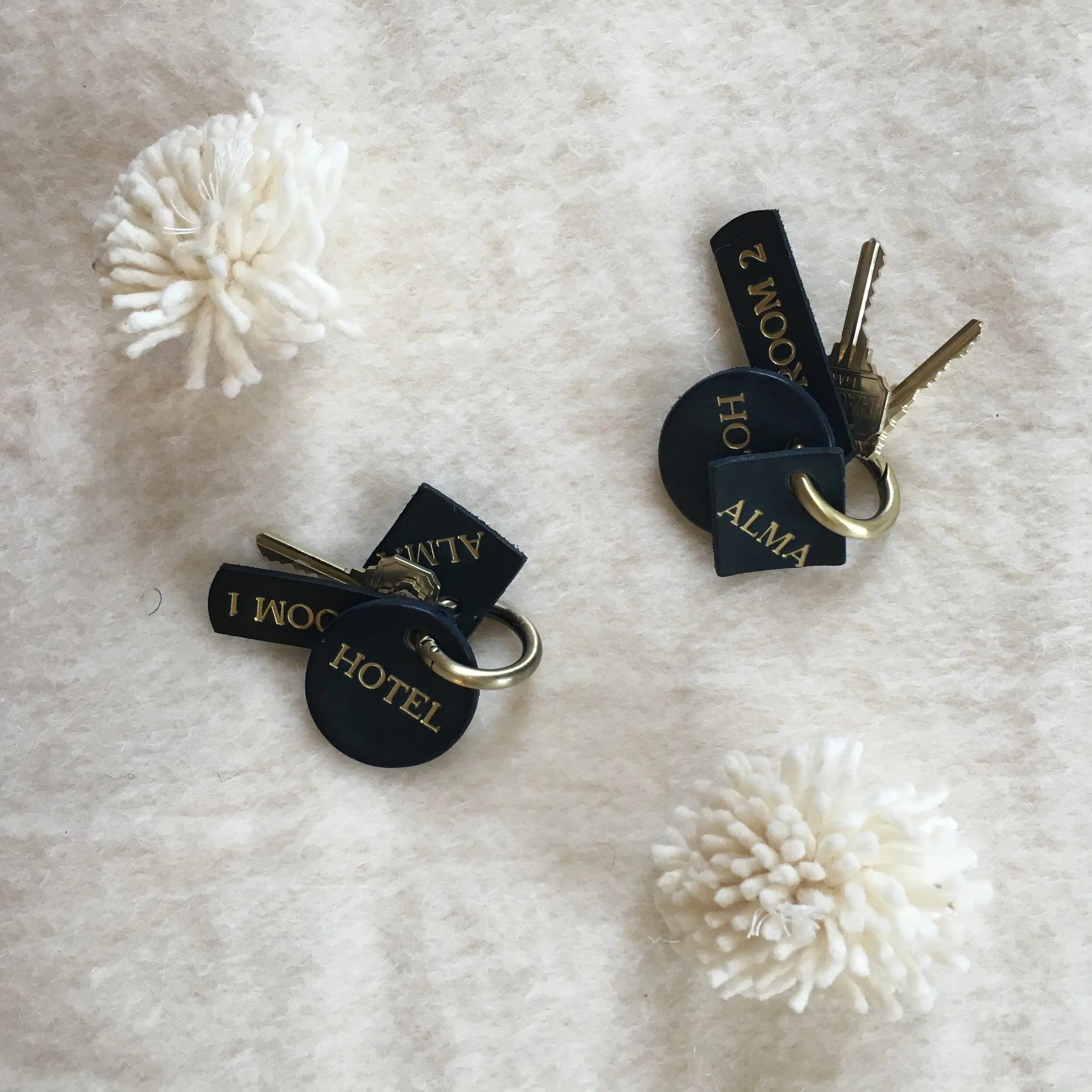 Alma hotel key fob design by Spring Finn & Co