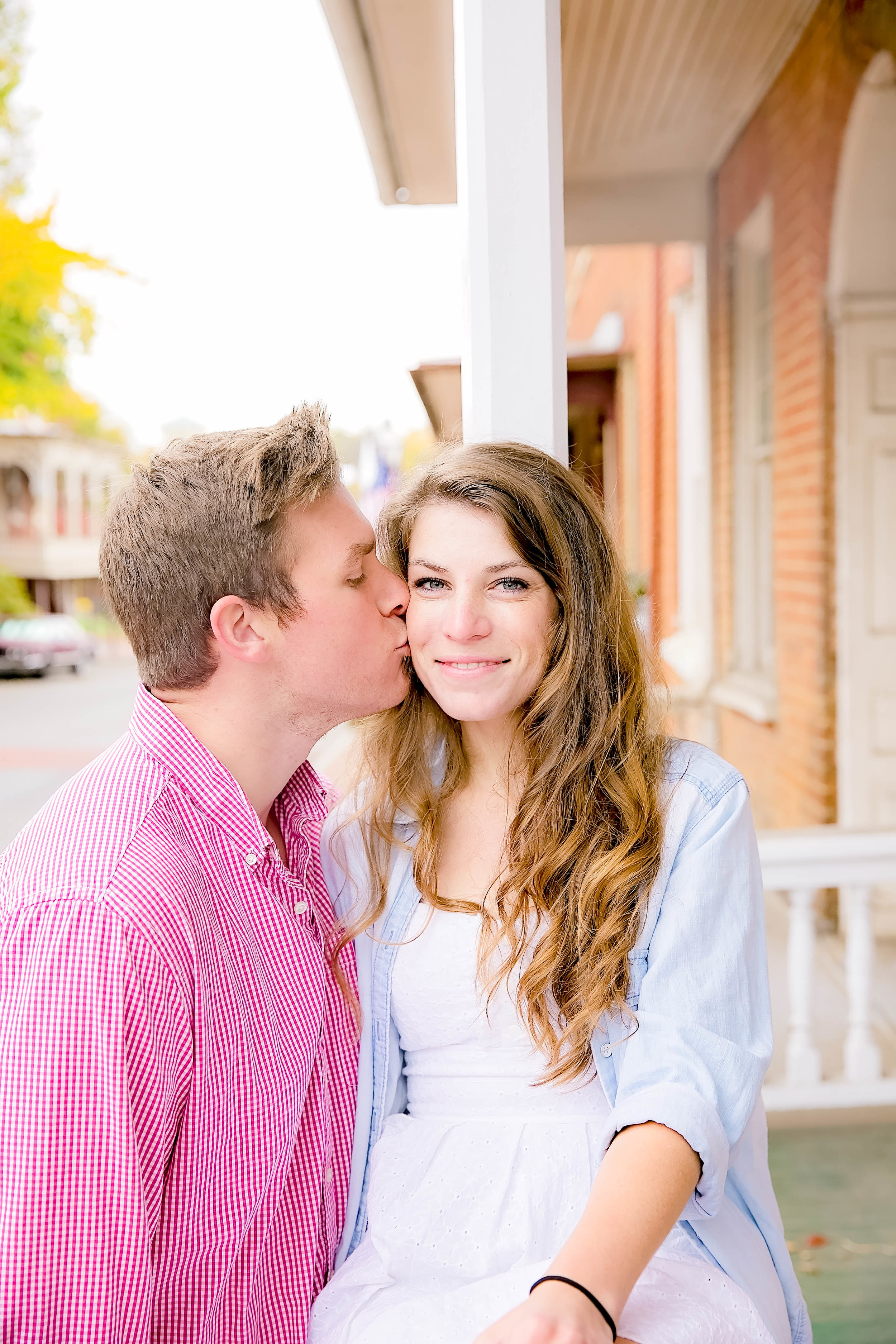 Downtown Jonesborough, TN sunrise engagement session cheek kiss