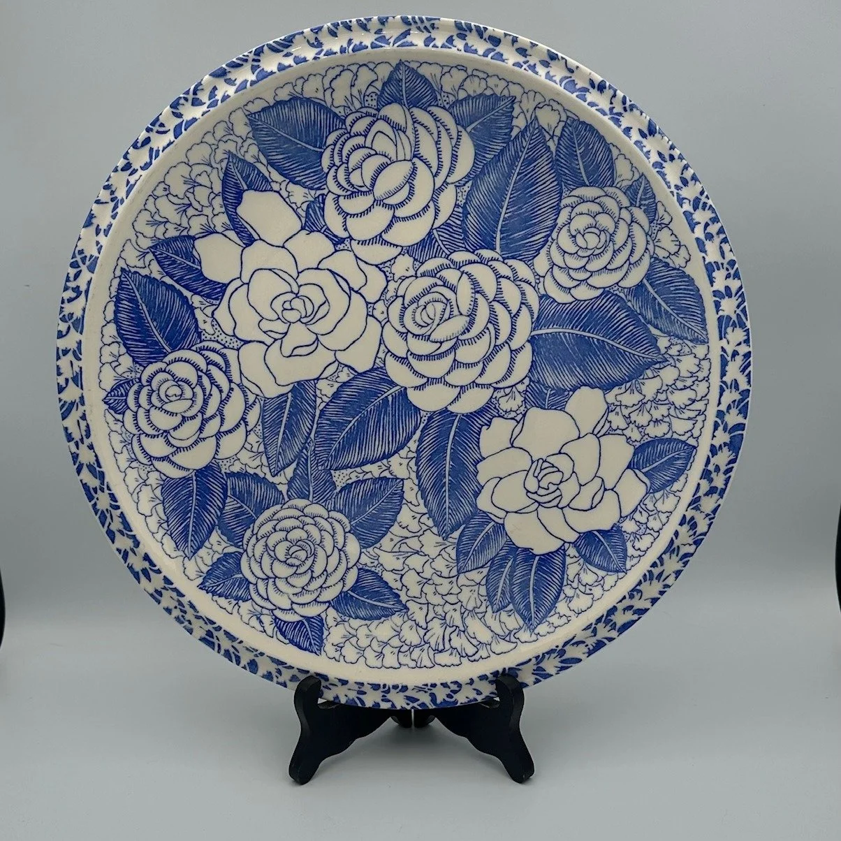 Vintage 1940s, Stunning plate designed by Don Blanding, and titled "Aloha". This extra large plate is covered in Hawaiin Flowers in shades of blue with a white background. Designed for Vernon Kilns, it has many uses, from display to charcut