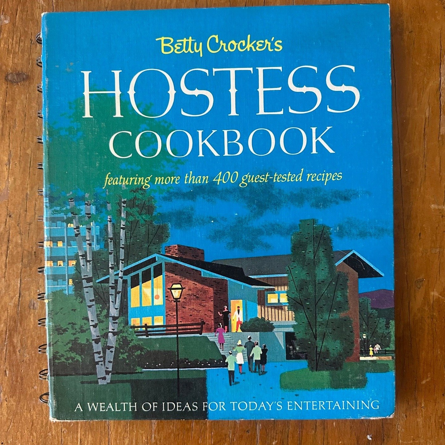 Vintage 1967, Betty Crocker's, Hostess Cookbook - Reading it feels like stepping back to a simpler era, when mealtime was celebrated. The cookbook features images of mid-century kitchen utensils and dishes, making it a true feast for the eyes! 1st Ed