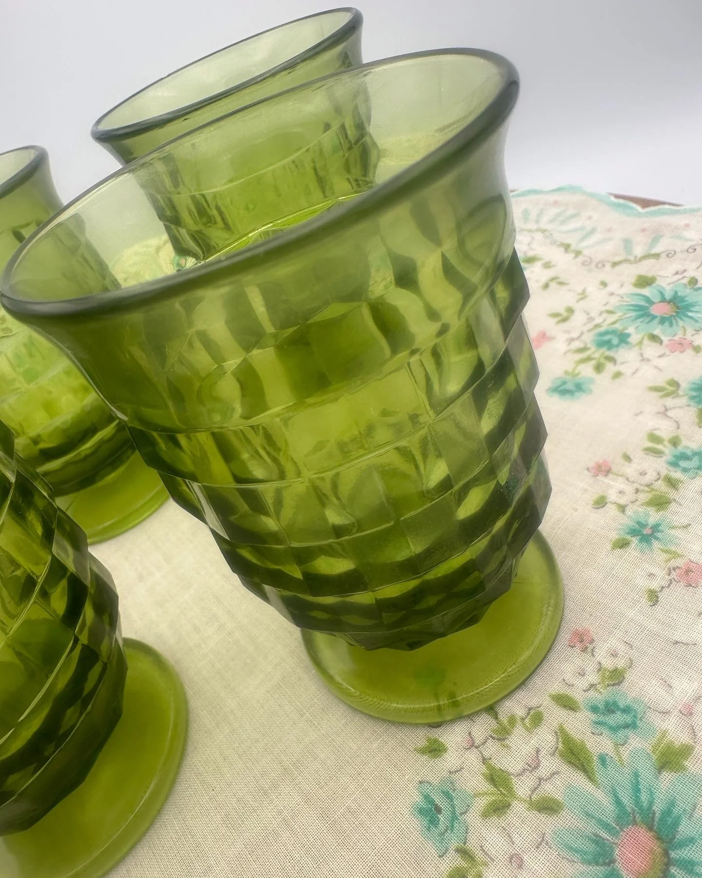 Add a pop of retro charm to your table!
This Set of 4 Vintage 1960s Indiana Glass &ldquo;Whitehall&rdquo; Cubist footed juice glasses are a true mid-century treasure. The striking color and geometric pattern bring bold character to any setting &mdash