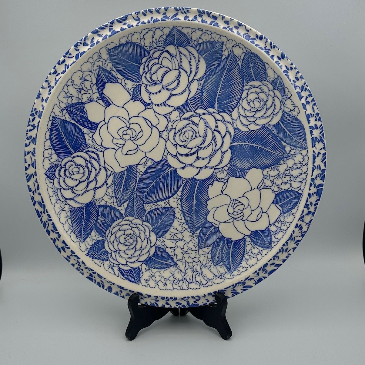 Vintage 1940s, Stunning plate designed by Don Blanding, and titled "Aloha". This extra large plate is covered in Hawaiin Flowers in shades of blue with a white background. Designed for Vernon Kilns, it has many uses, from display to charcut