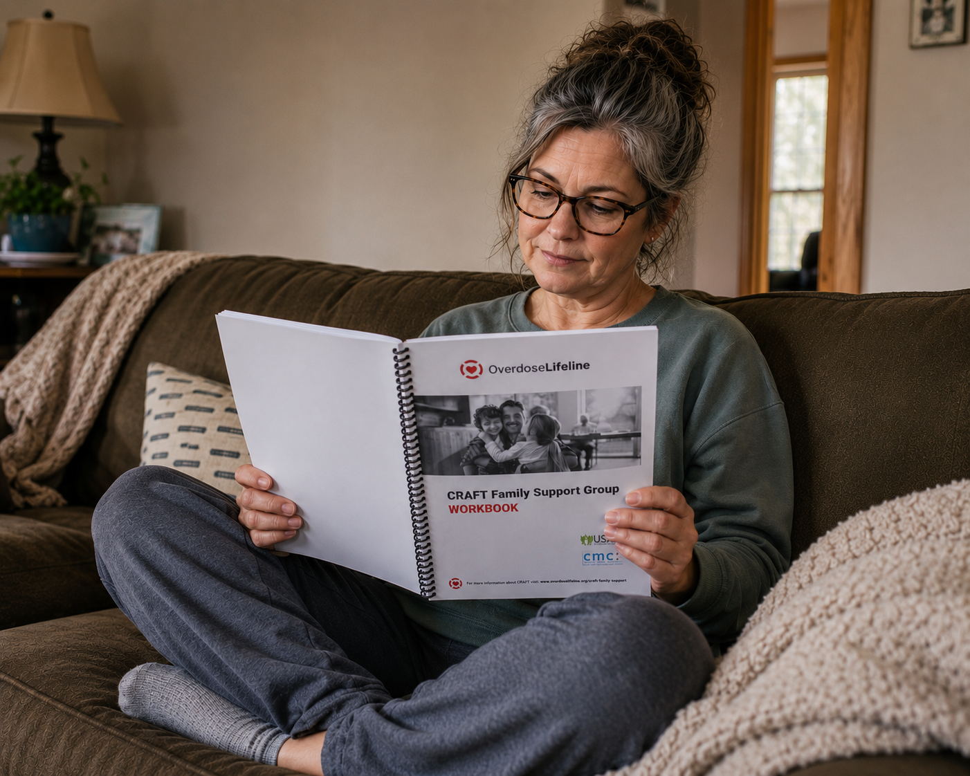 Woman reading a CRAFT Family Support Group workbook for families affected by a loved one’s substance use.