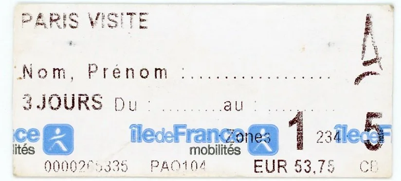 A train ticket for travel from Paris, France, with details including dates, price in euros, and the Île-de-France mobility zone. The ticket appears worn and has some text and logos.
