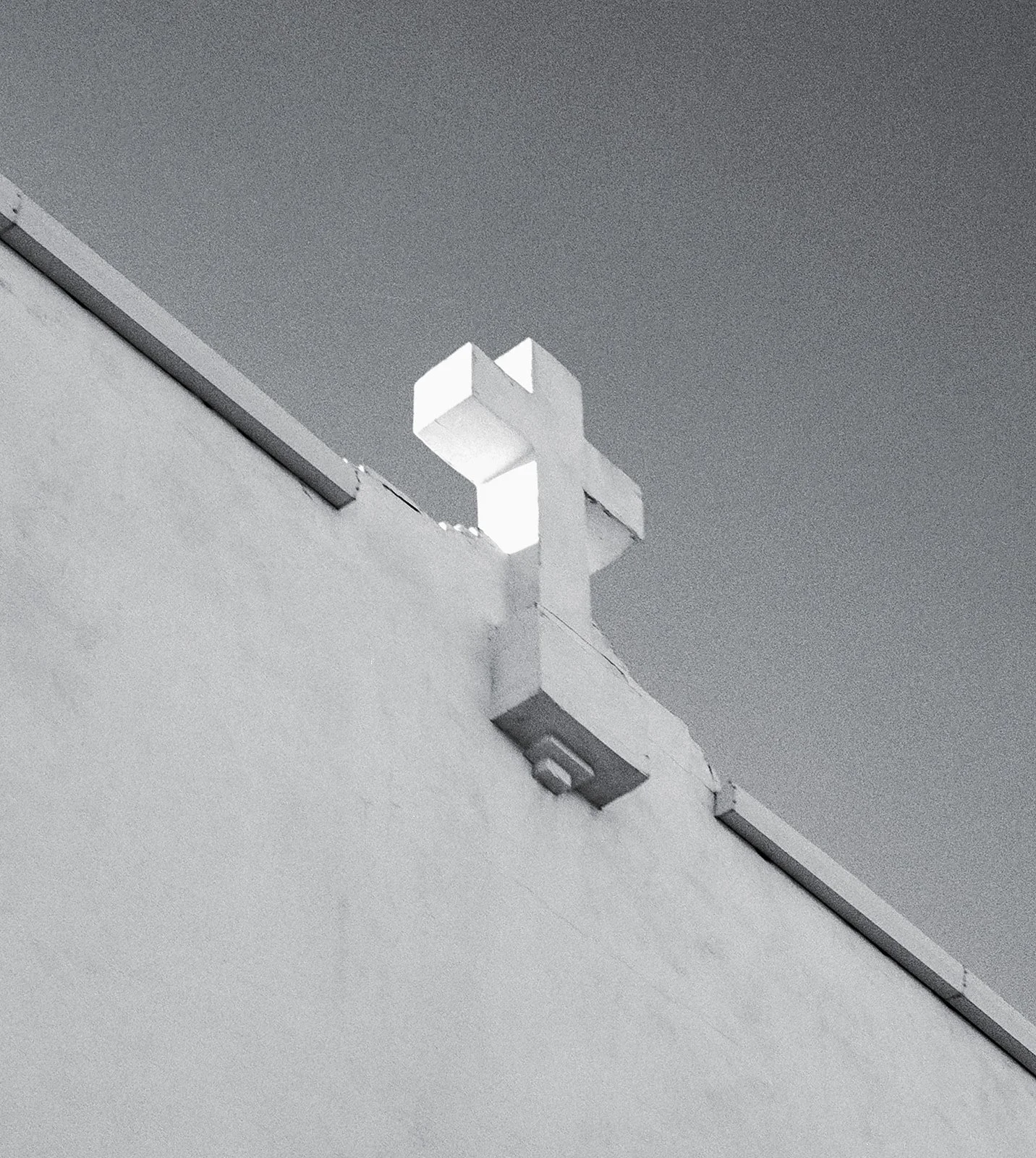 A black and white image of the cross at a church in Marfa.
