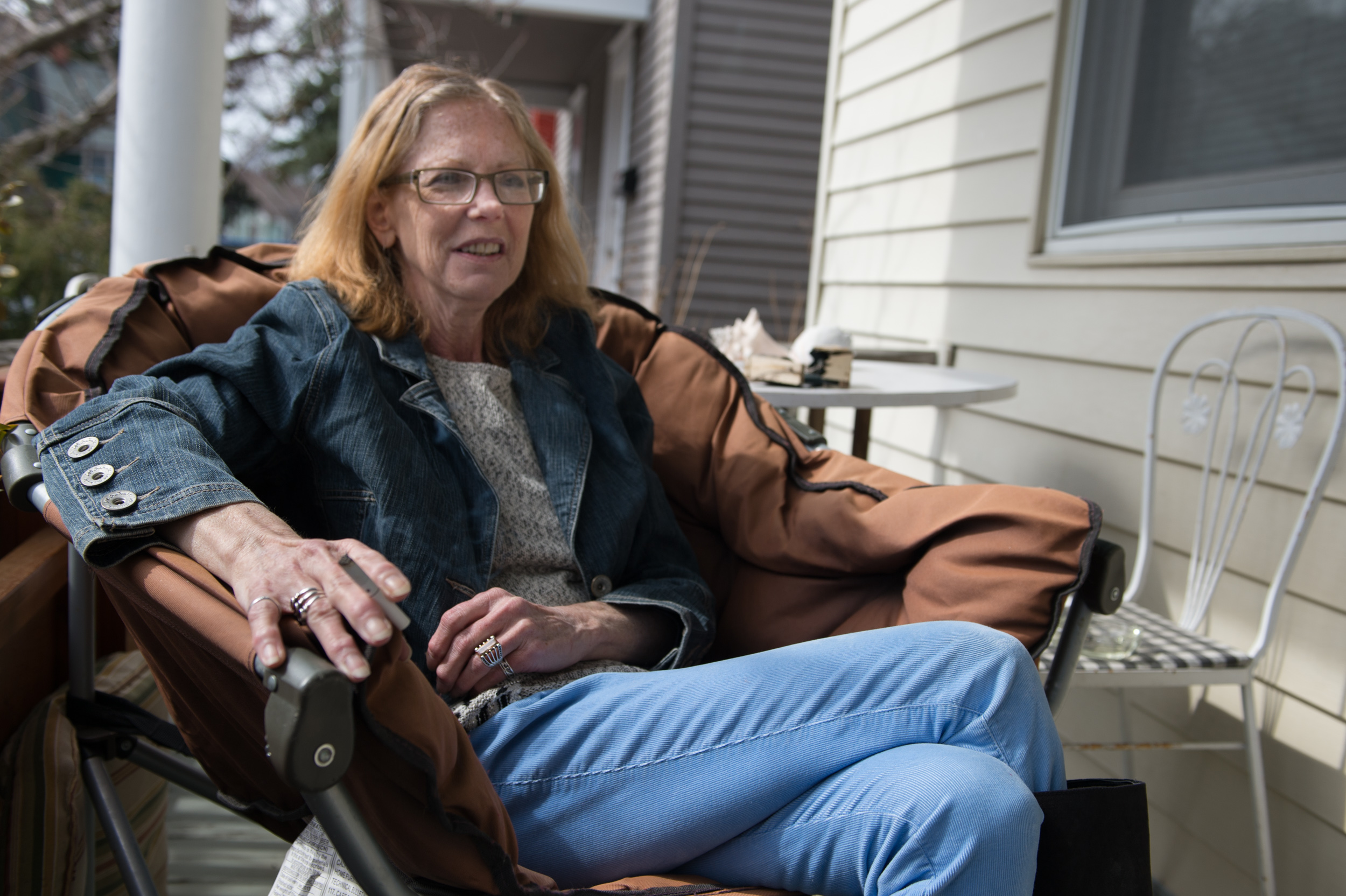  Carol Heveron laughs as she tells a story while sitting on her porch at her house in Rochester, N.Y.,&nbsp;Friday, April 3, 2015.&nbsp; 