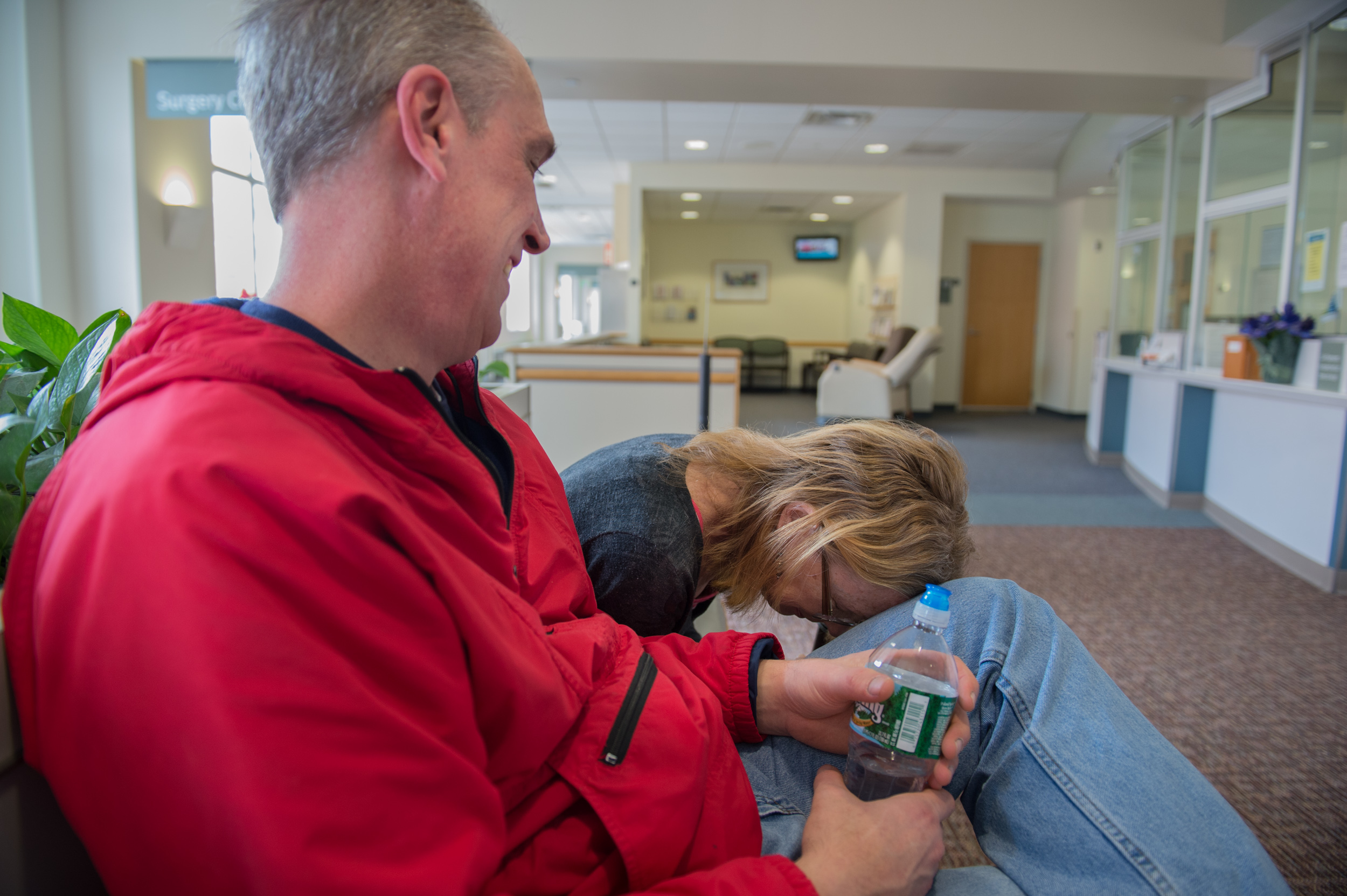  Carol places her head on her friend Erik Lacelle's knee after having a tube removed from her lungs at Strong Memorial Hospital in Rochester on Thursday, April 2, 2015. "Erik's a good guy," she said. "Sometimes he comes over on the weekends and we ha