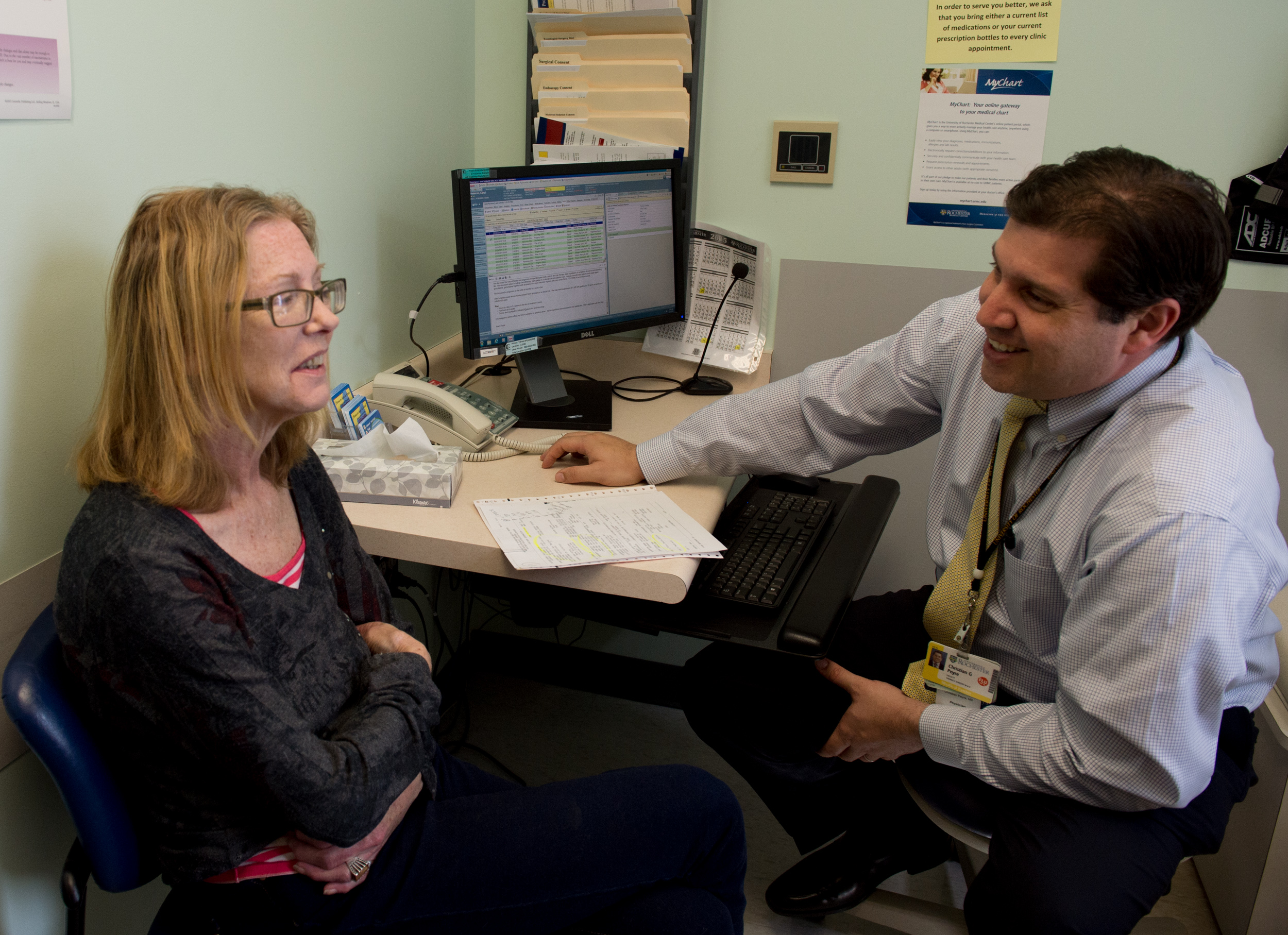  Carol makes a joke as she discusses treatment options with a doctor at Strong Memorial Hospital. She had received chemo therapy the first time she had cancer and had lost an unhealthy amount of weight as a result. 