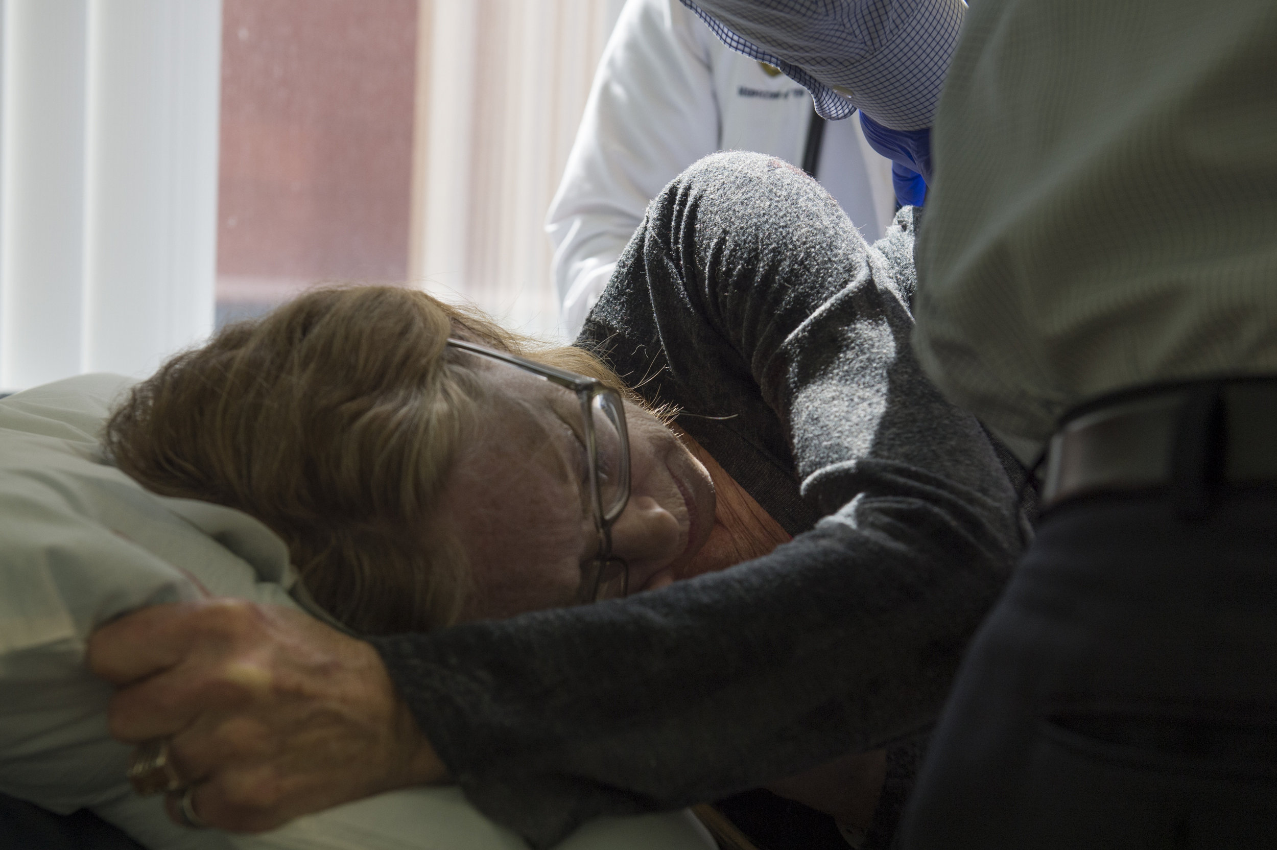  Carol Heveron reacts to doctors removing a chest tube that was inserted for lung drainage after a biopsy.&nbsp;Heveron had received the biopsy two weeks prior where surgeons removed a part of her lung for a wedge resection. 