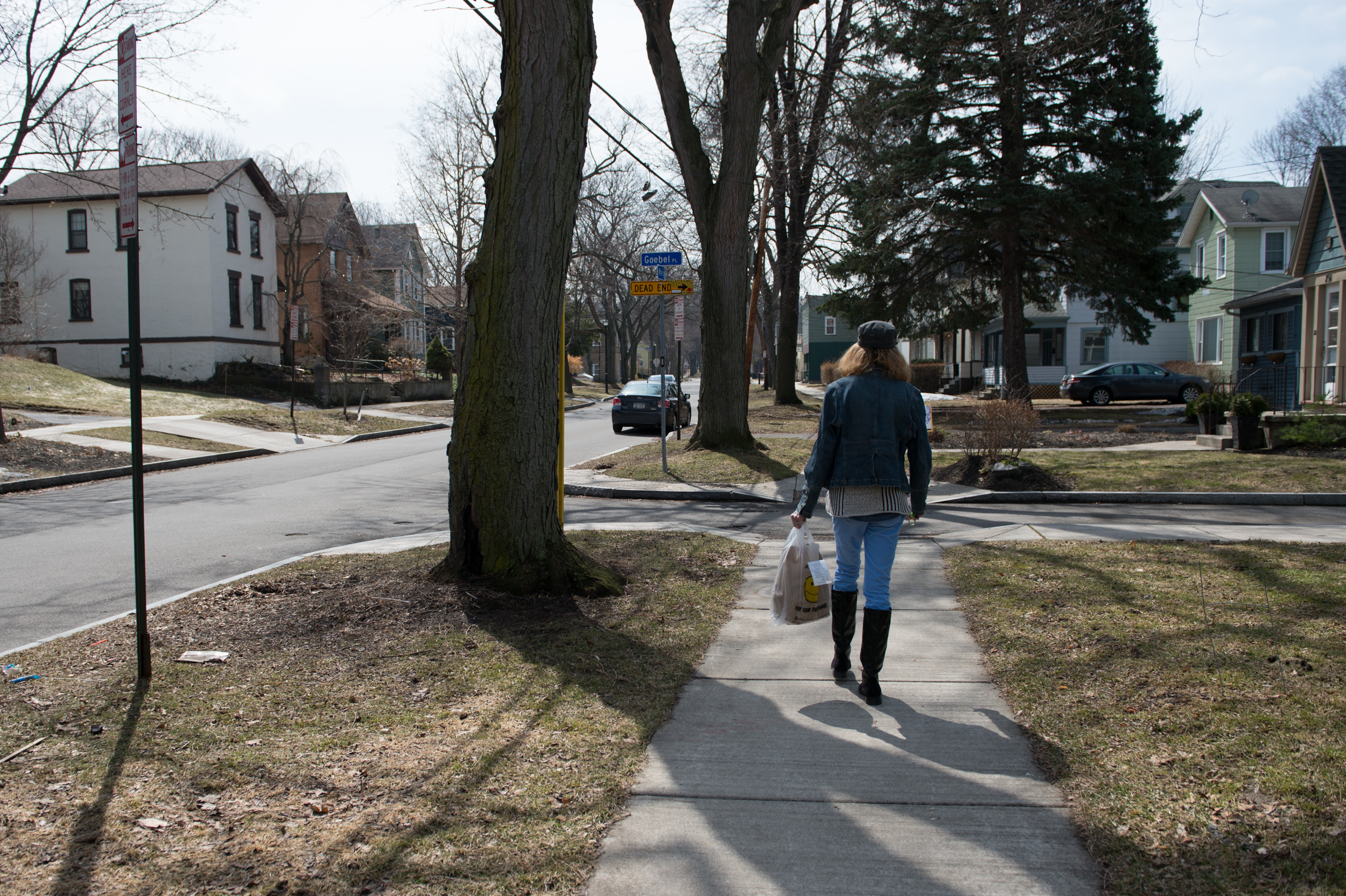  Carol walks home after picking up some Friday evening takeout. 